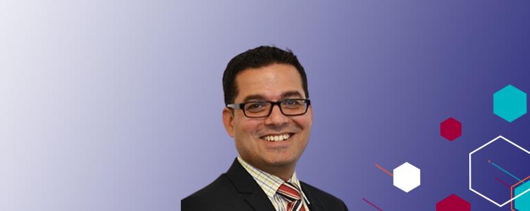 headshot of Shyam Raghupathi on a purple background