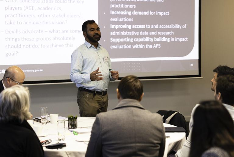 Shantanu Sheshgir from the Australian Centre for Evaluation addressing a group of attendees an impact evaluation workshop. 