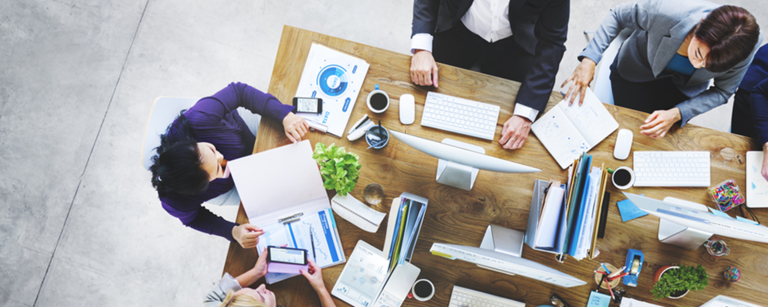 A group of people working around a table