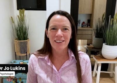 A screencapture of a virtual conversation with Dr Jo Lukins featuring Dr Jo sitting in front of some plants