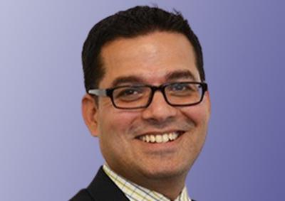 headshot of Shyam Raghupathi on a purple background